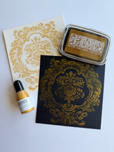 Load image into Gallery viewer, IOD Gold Shimmer Pigment Ink stamped on cardstock showing metallic gold finish
