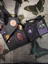 Load image into Gallery viewer, Open Howl-O-Ween Manor Halloween junk journal showing decorated pages and vintage Halloween designs
